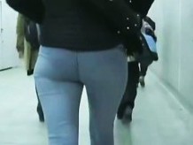 Plump bottomed  lady in tight jeans chased by a street voyeur
