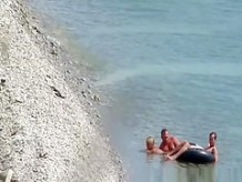 Nudist couple fucking in the water and shore